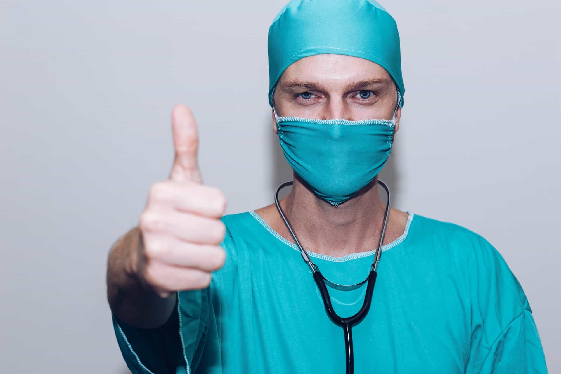 Surgeon giving a thumbs up